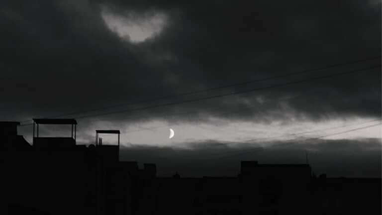 Black moon Lilith in Gemini represented by a dark night sky with the moon.