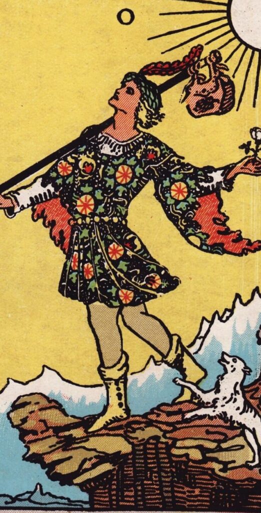 The Fool card from the Rider-Waite tarot, showing a youth standing at the edge of a cliff with a white rose and small dog.