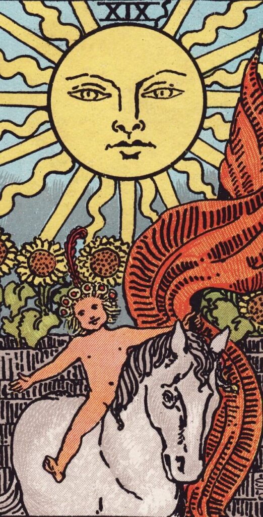 The Sun card from the Rider-Waite tarot, showing a child on a white horse beneath a bright sun with sunflowers behind.