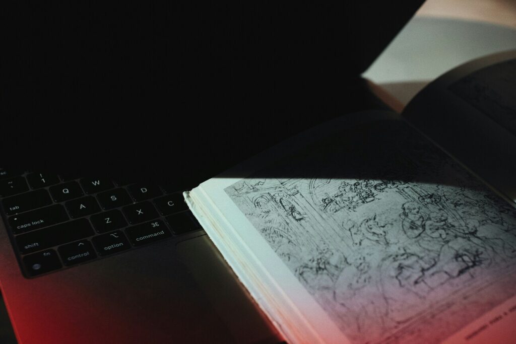 AI birth chart reading concept image with laptop and astrology book.