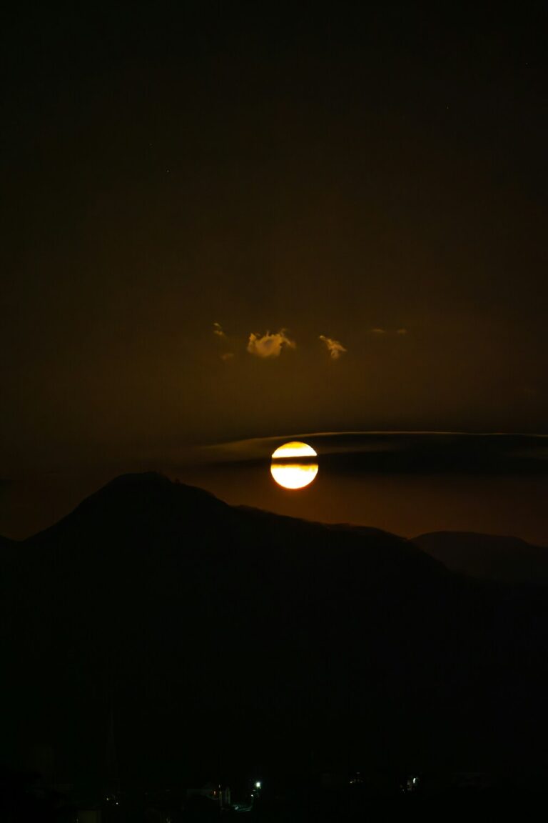 Aquarius Solar Eclipse on February 17, 2026 over dark mountains.