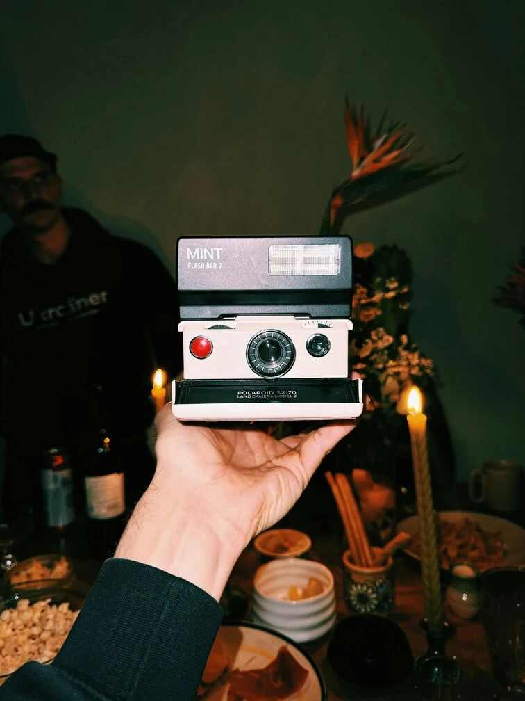 Mars in Pisces symbolism through a vintage camera photography, evoking memoris, blurred boundaries, and intuitive vision.