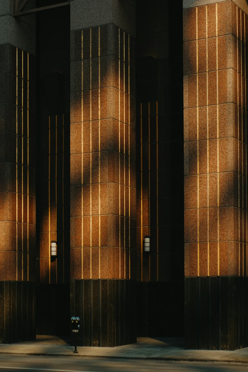 Neptune in the 8th house symbolism with dark architectural shadows and light.