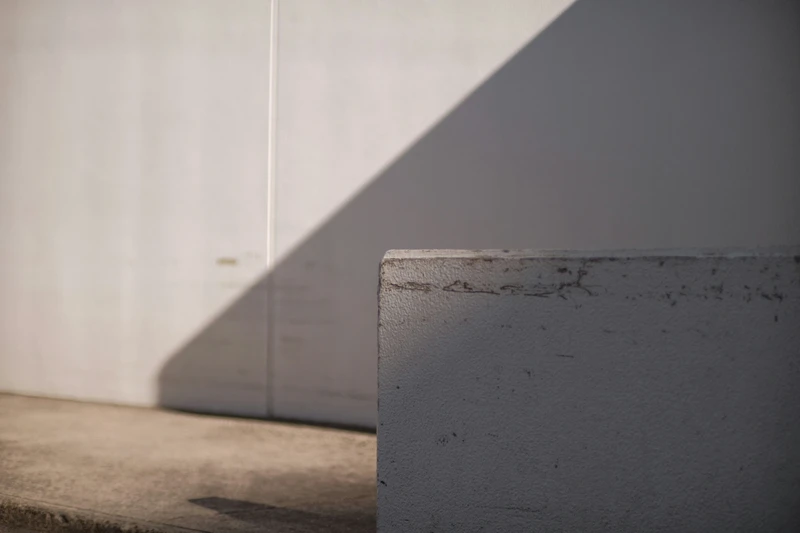 saturn return grey background representing suspension and stillness, minimal and atmospheric, soft gradients and empty space symbolizing pause.