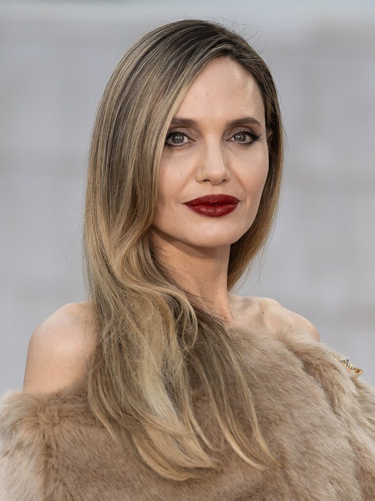 cancer rising Angelina Jolie portrait, soft gaze and composed presence, reflecting emotional depth, privacy, and quiet strength
