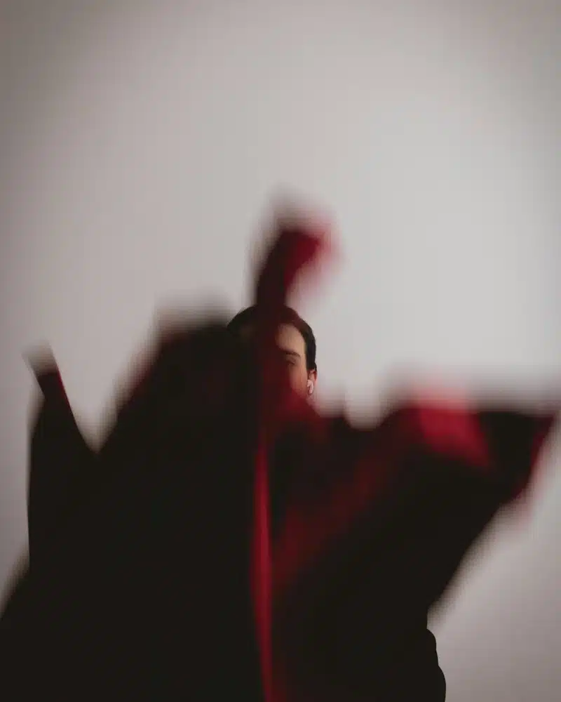 aries rising movement blurred figure in motion, symbolizing action, immediacy, and the instinctive energy of this Ascendant