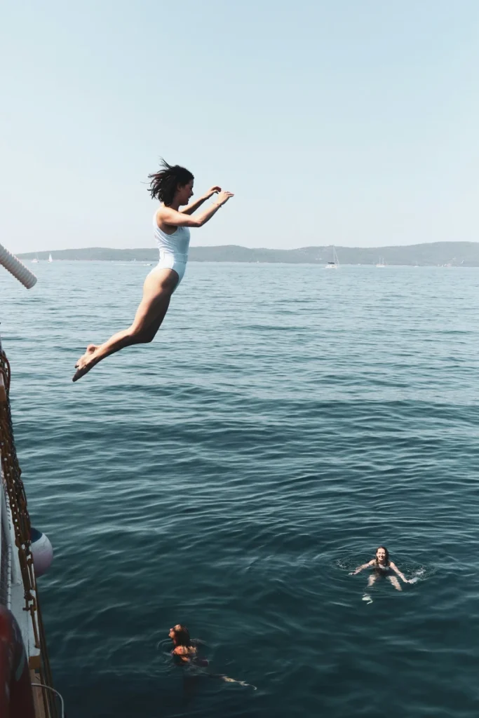 astrology communication in the birth chart, woman diving into water, symbolic image of Mercury and emotional expression