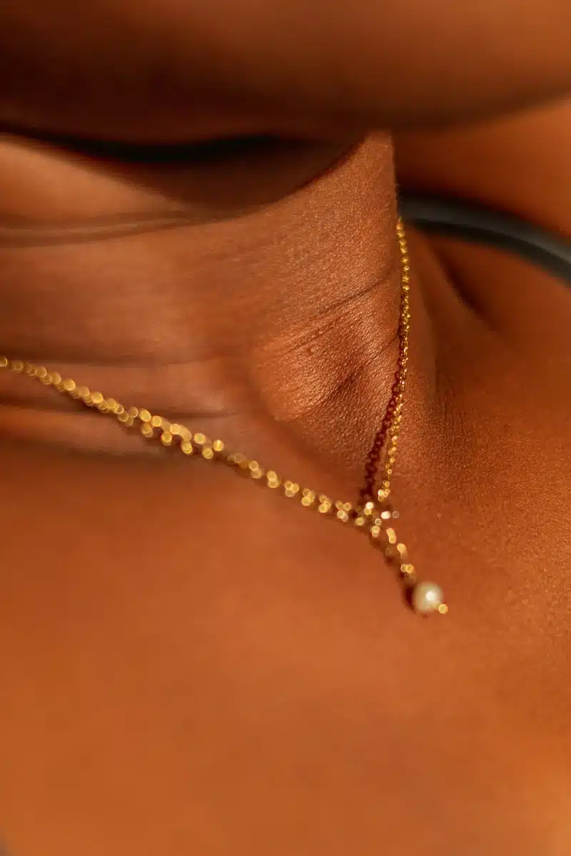 taurus rising beauty close-up of a neck with a delicate necklace, symbolizing the natural expression of Venusian beauty