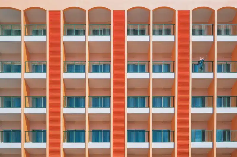 venus in cancer symbolism, pattern of windows on a building facade representing emotional layers, protection, and the idea of home