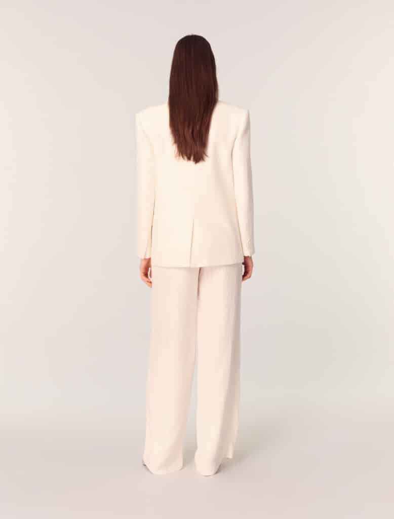 moon edit, white women’s outfit photographed from behind symbolizing softness, reflection, elegance, and quiet lunar energy