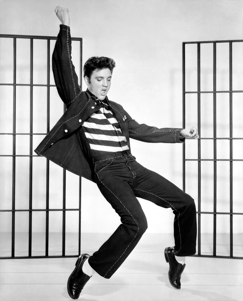 sagittarius rising black and white photo of Elvis Presley dancing, expressive movement and charismatic energy reflecting freedom and vitality