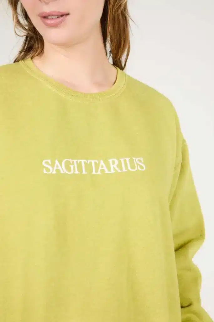 sagittarius rising yellow sweatshirt with sagittarius lettering, casual expressive style with vibrant adventurous aesthetic