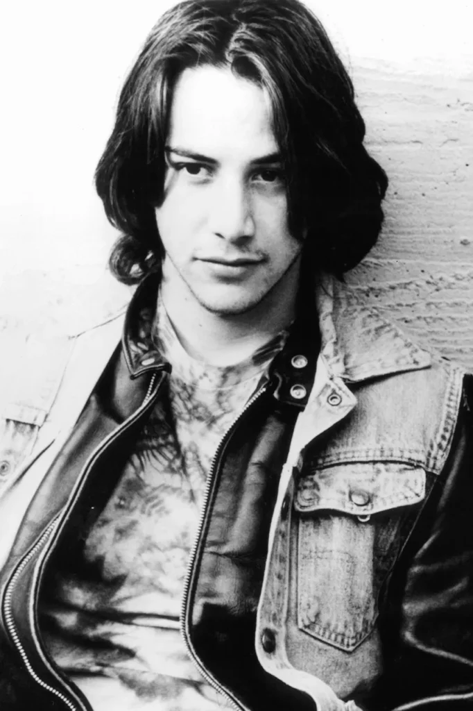 virgo rising Keanu Reeves black and white portrait, composed expression and attentive gaze reflecting precision, restraint, and quiet presence