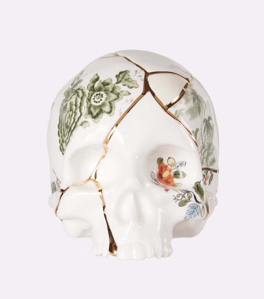 Colorful Seletti skull with gold crack details, selected for the Aquarius Full Moon shop the mood collection.