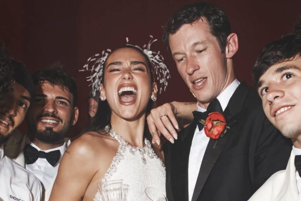 Dua Lipa birth chart image showing Dua Lipa celebrating with her husband during a joyful moment, surrounded by an elegant and festive atmosphere.