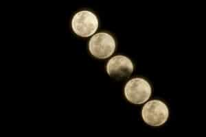 Lunar eclipse in Pisces 2026 image showing multiple phases of the Full Moon crossing a black night sky.