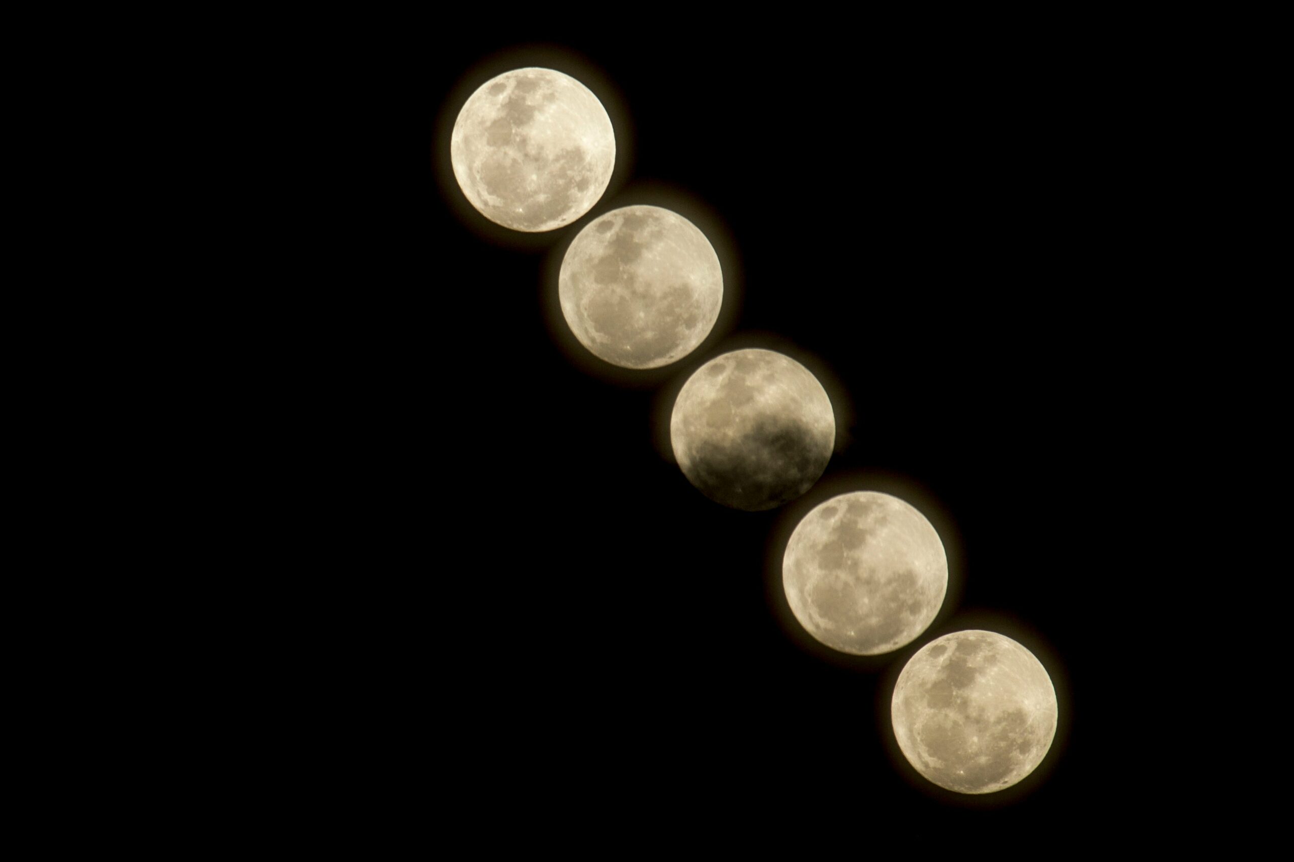 Lunar eclipse in Pisces 2026 image showing multiple phases of the Full Moon crossing a black night sky.