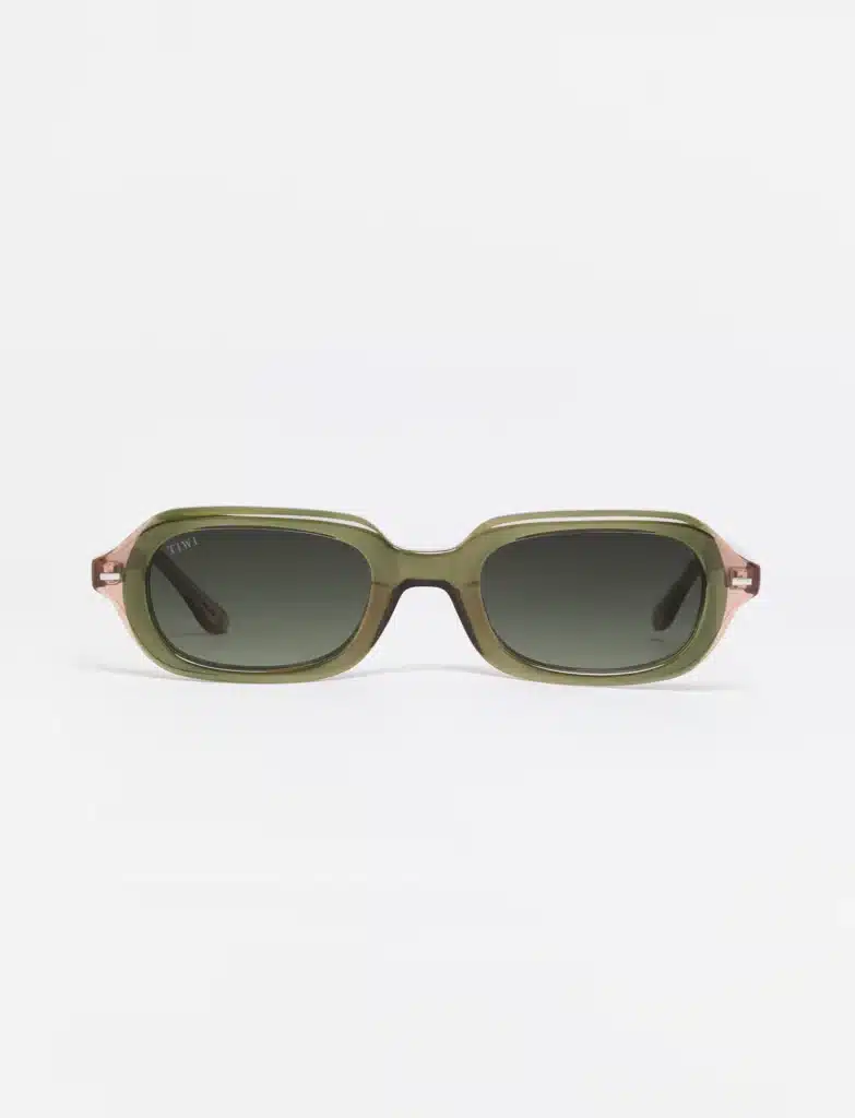 Virgo Season style featuring olive-green rectangular sunglasses with dark gradient lenses and subtle pink translucent arms.