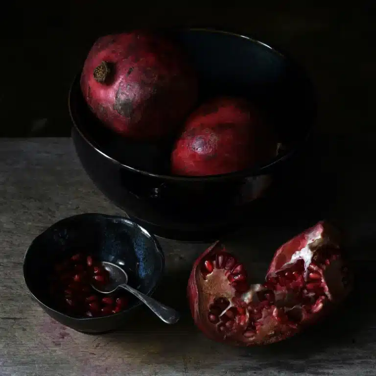 Venus Enters Scorpio: Meaning, Dates, Love, and Effects on Each Zodiac Sign Venus in Scorpio symbolised by dark red pomegranates arranged in black bowls, evoking Persephone and the Underworld.