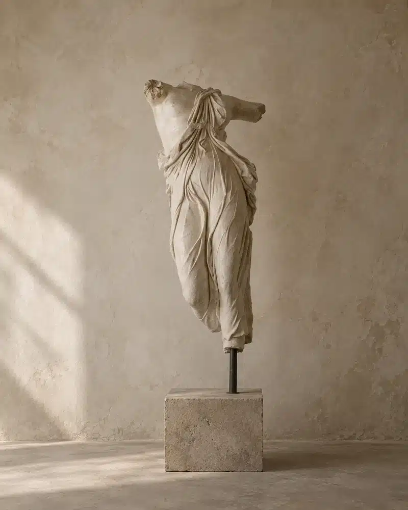 Full Moon in Taurus: Meaning, Energy, and How It Affects Each Zodiac Sign Full Moon in Taurus image with a classical headless statue on a stone pedestal against a warm wabi sabi wall, evoking grounding, stillness, beauty, and earthy stability.
