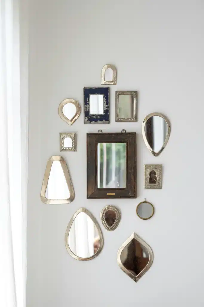 Libra New Moon image with a gallery wall of antique mirrors, symbolizing reflection, balance, beauty, and new intentions in relationships.
