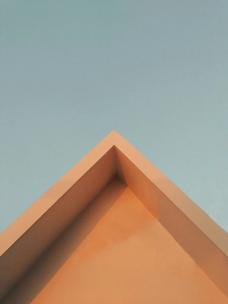Libra Season image with a balanced architectural corner against a soft blue sky, symbolizing measure, harmony, proportion, and the quiet beauty of this astrological season.
