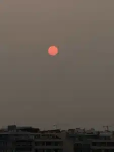 Scorpio Season picture of the dark sky with a red moon in the middle