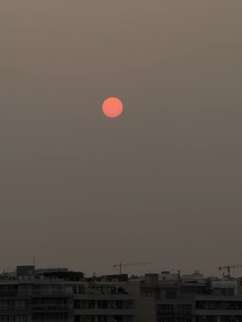 Scorpio Season picture of the dark sky with a red moon in the middle