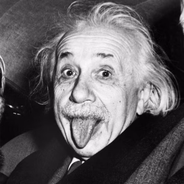 Albert Einstein's black and white famous portrait of him with his tongue out of his mouth.