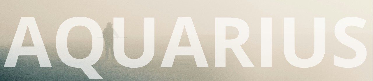 Aquarius horoscope banner. Lone figure in a misty landscape.