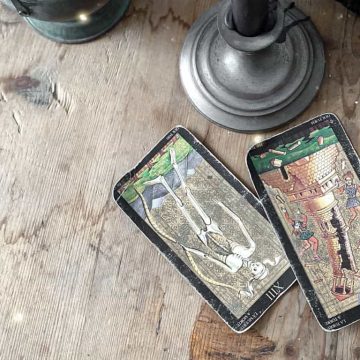 Visconti Tarot cards on a wooden table. The Visconti Tarot deck is one of the best and most ancient decks.