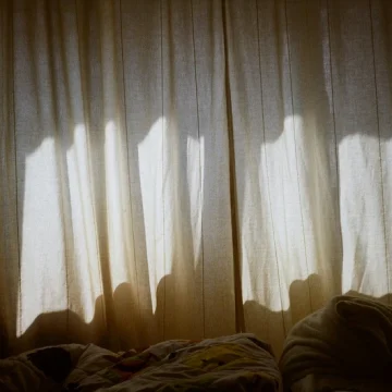 cancer rising softness sheer curtains with gentle light and shadow, evoking a soft, protective atmosphere and emotional sensitivity