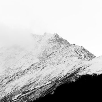 Capricorn season represented by a white mountain.