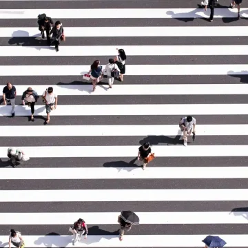 Career astrology concept: people crossing street different paths.