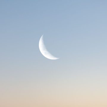 Moon in a light-blue sky