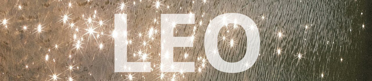 Leo horoscope banner. Sparkling light reflections on water.