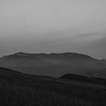 Mars in Scorpio 2025 – a dark, moody mountain landscape in black and white, symbolizing intensity, depth, and transformation.