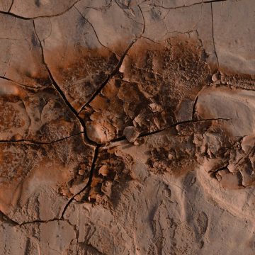 Mars in Libra 2025 concept image: cracked red earth evoking tension and balance