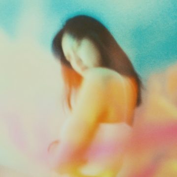 Saturn conjunct Neptune in Aries 2026, dreamy blurred portrait symbolizing a new astrological era.