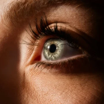 virgo rising close-up of a light-colored eye, sharp focus and clean detail highlighting observation, clarity, and precise perception