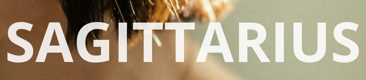 Sagittarius horoscope banner. Close-up of golden light on hair strands.