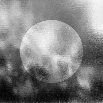 Abstract image of the Sagittarius New Moon symbol on a textured background.