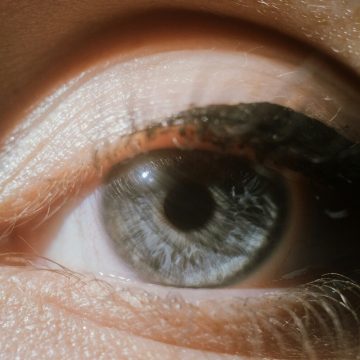 Sagittarius Season 2025 eye close-up symbolizing vision, truth, and inner awakening under warm light.