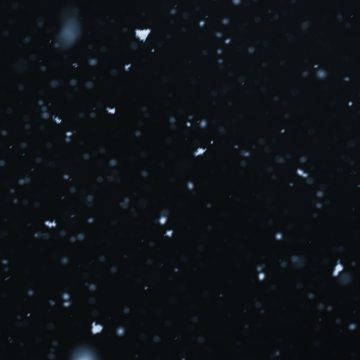 Saturn in Aquarius represented by a night sky.