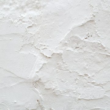 White wall representing the cold, resilient nature of Capricorn.