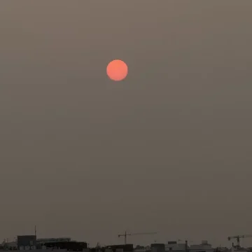 Scorpio Season picture of the dark sky with a red moon in the middle