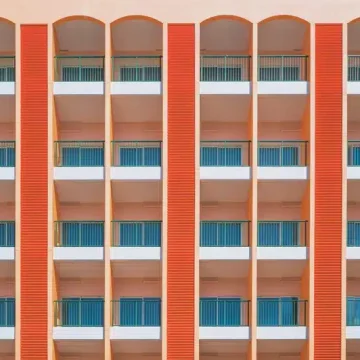 venus in cancer symbolism, pattern of windows on a building facade representing emotional layers, protection, and the idea of home