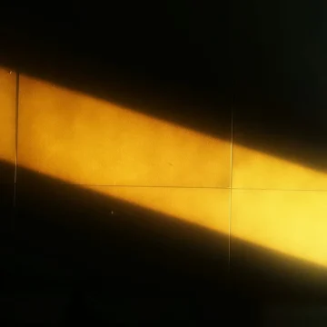 Venus in Leo energies of the transit represented by a warm sun light on a wall.